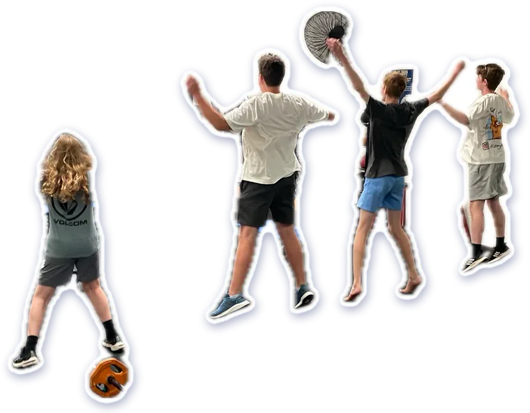 Members high-fiving across the gym floor in a circuit class
