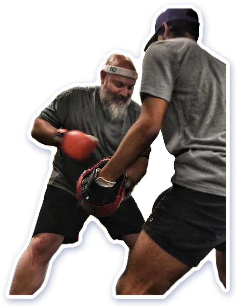 Boxing pad work with a trainer