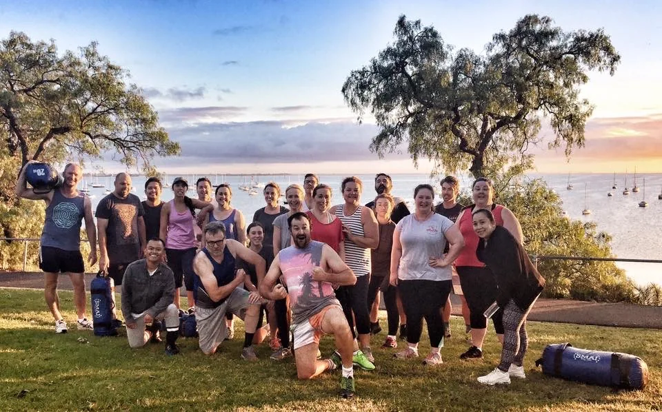 A big group on the waterfront at sunset